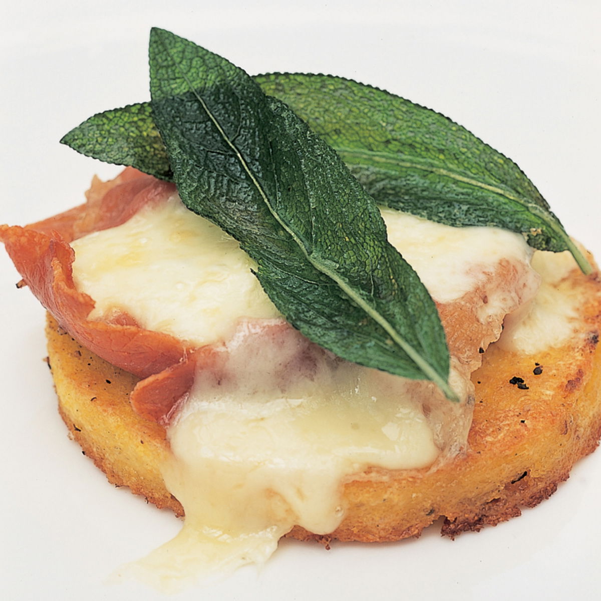 Italian grilled polenta with ham melted fontina and sage