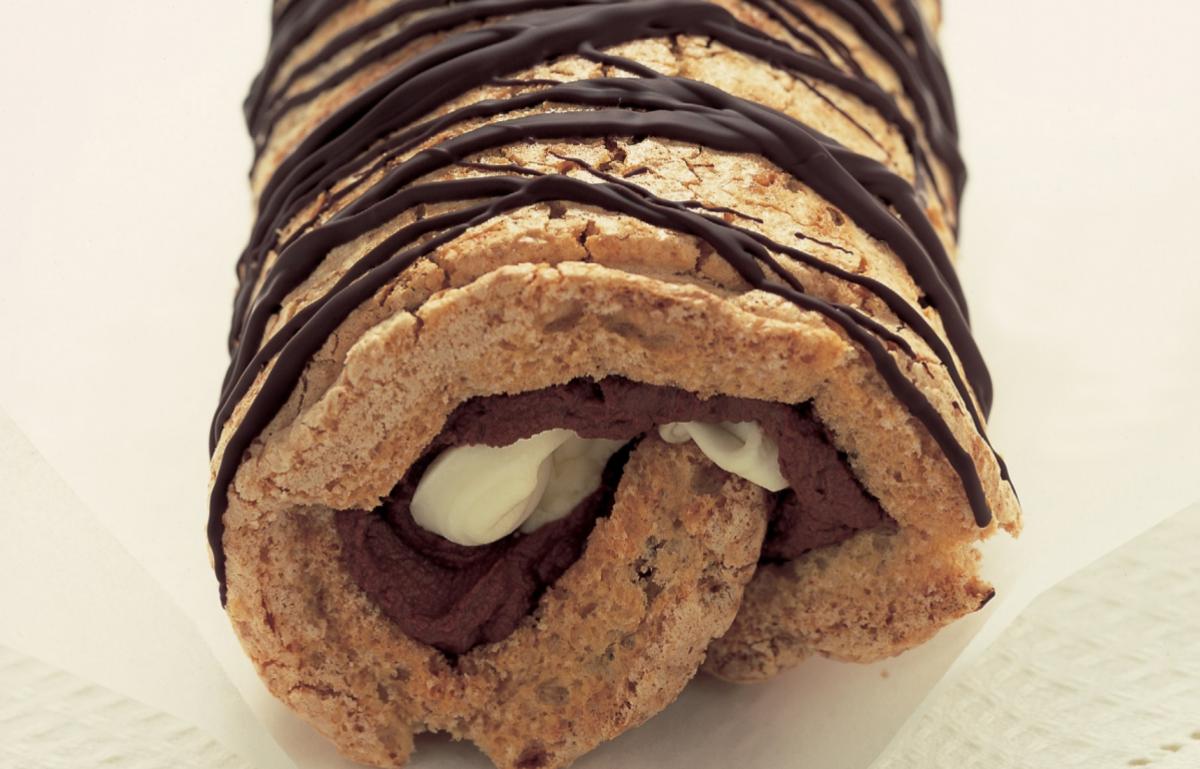 A picture of Delia&#039;s Rolling the Chocolate Hazelnut Meringue Roulade ahead  ask Lindsey question