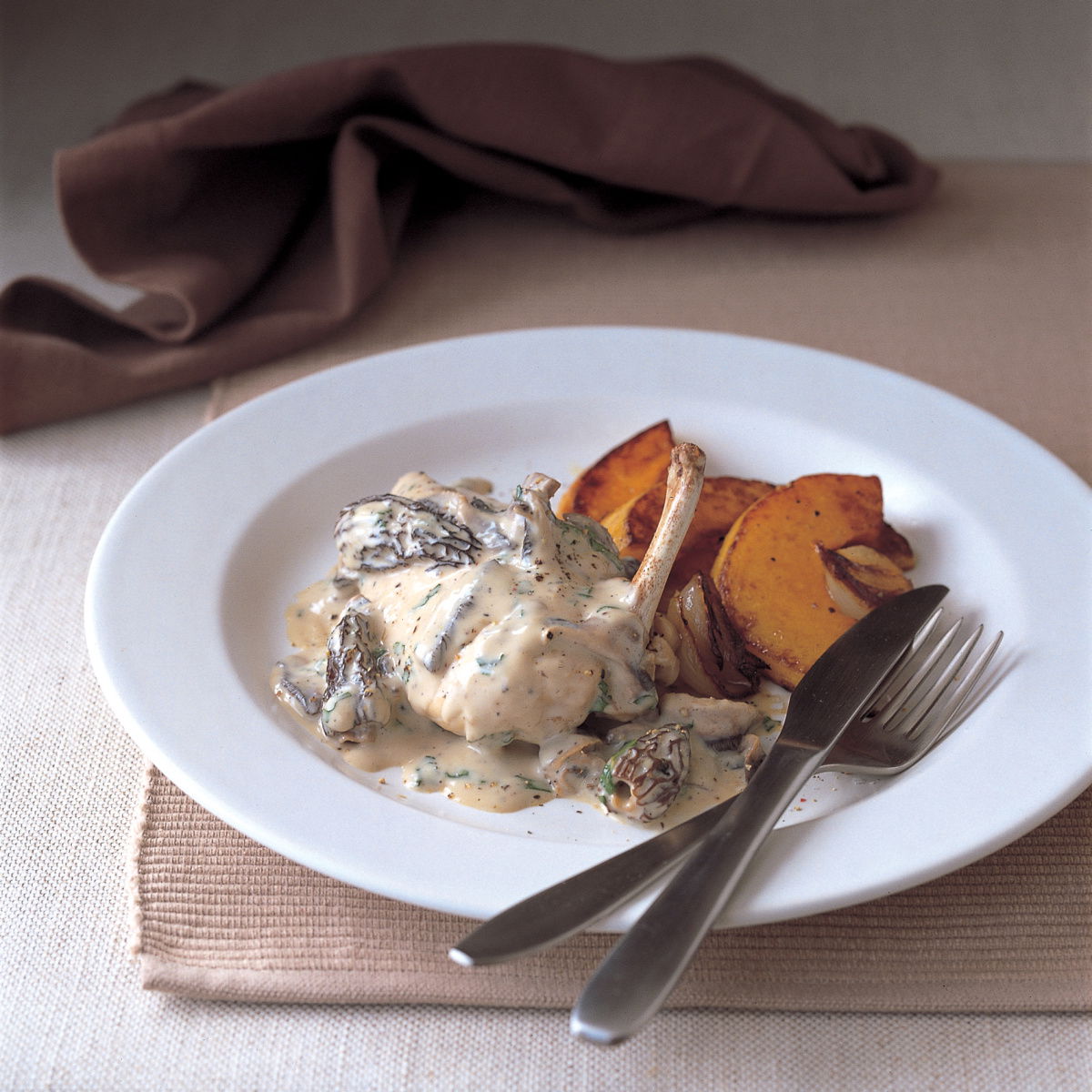 Chicken poached chicken breasts with morel mushrooms cream and parsley